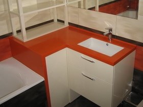 мебель для ванной комнаты из камня с оранжевой столещницей